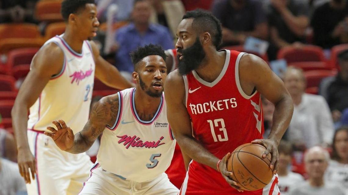 Houston Rockets guard James Harden looks to pass the ball against Miami Heat forward Derrick Jones Jr. in the first quarter of a game at the AmericanAirlines Arena in Miami on Wednesday, February 7, 2018.