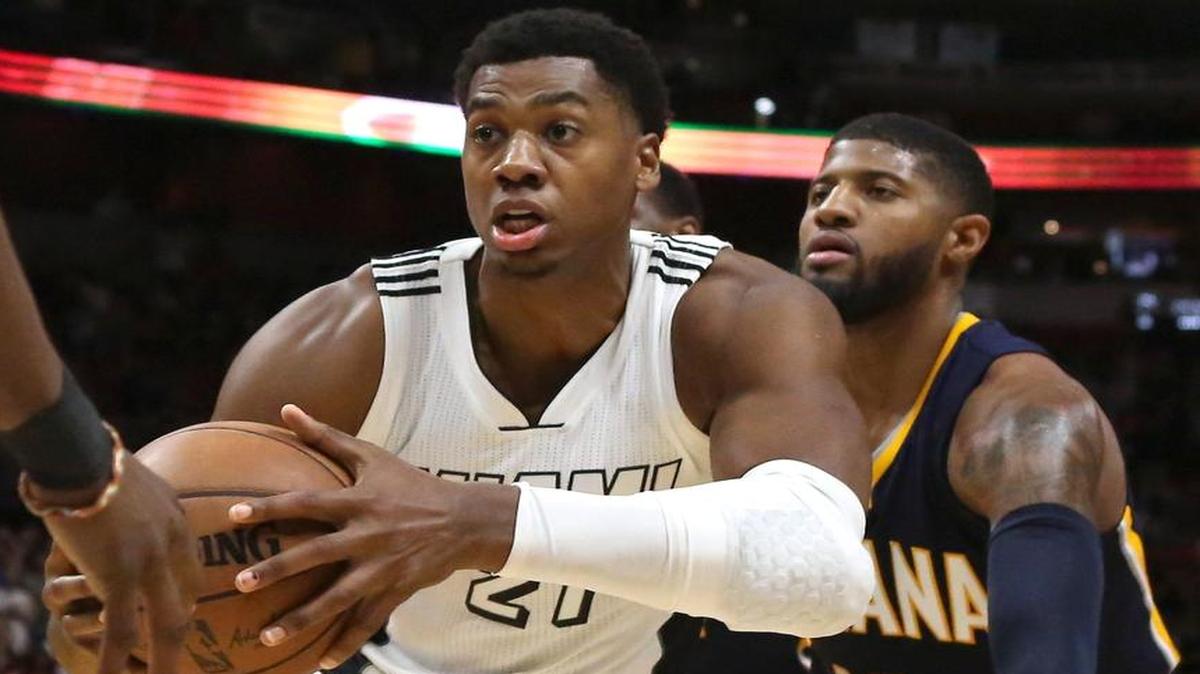 Miami Heat center Hassan Whiteside pulls down a rebound against Indiana Pacers forward Paul George (13) during the fourth quarter of an NBA basketball game at AmericanAirlines Arena in Miami on Wed., Dec. 13, 2016.