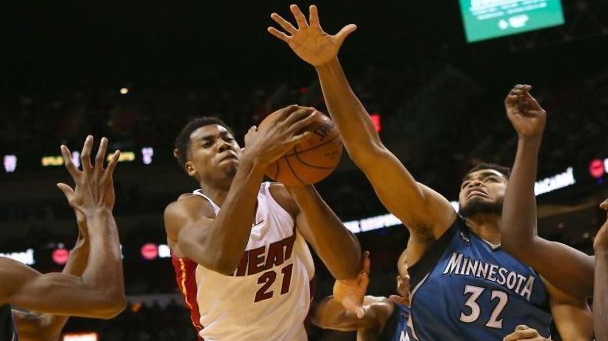 Miami Heat center Hassan Whiteside pulls down one of his 14 rebounds against the Minnesota Timberwolves at AmericanAirlines Arena in Miami on Tuesday, Nov. 17, 2015.