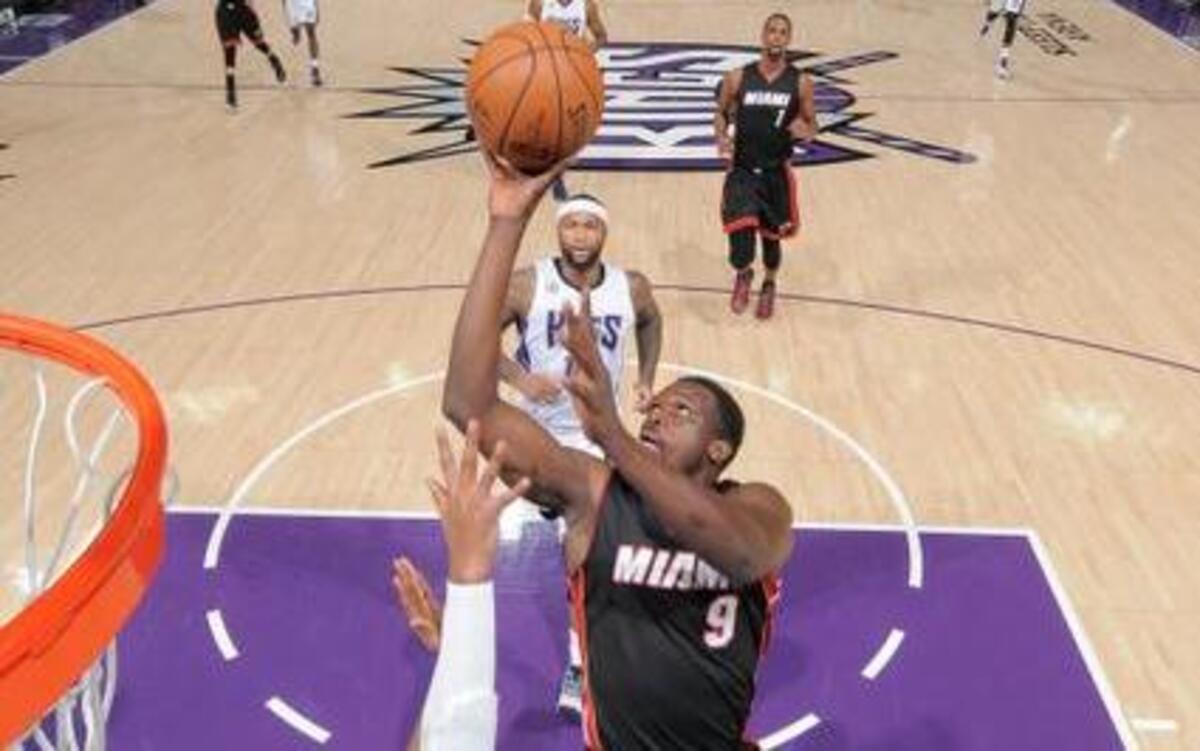 
Luol Deng (9) of the Miami Heat shoots the ball against the Sacramento Kings at Sleep Train Arena on Jan. 16, 2015, in Sacramento, California.
