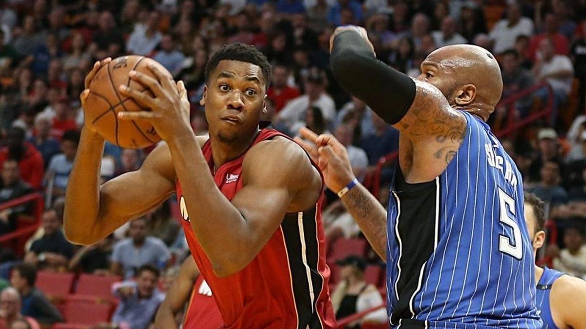 Miami Heat center Hassan Whiteside goes to the basket against Magic Orlando forward Marreese Speights in the second quarter of a game at AmericanAirlines Arena in Miami on Tuesday, December 26, 2017.