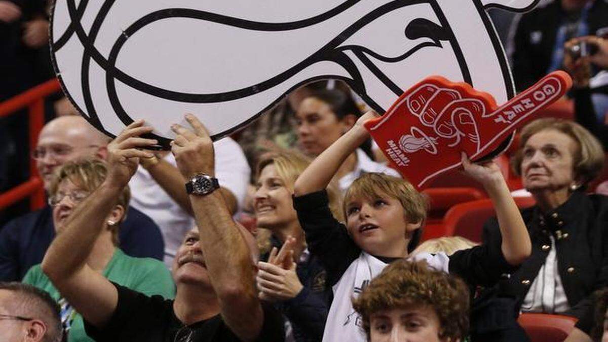 
Heat fans show their support as the Miami Heat host the New Orleans Pelicans at AmericanAirlines Arena on Feb. 21, 2015.
