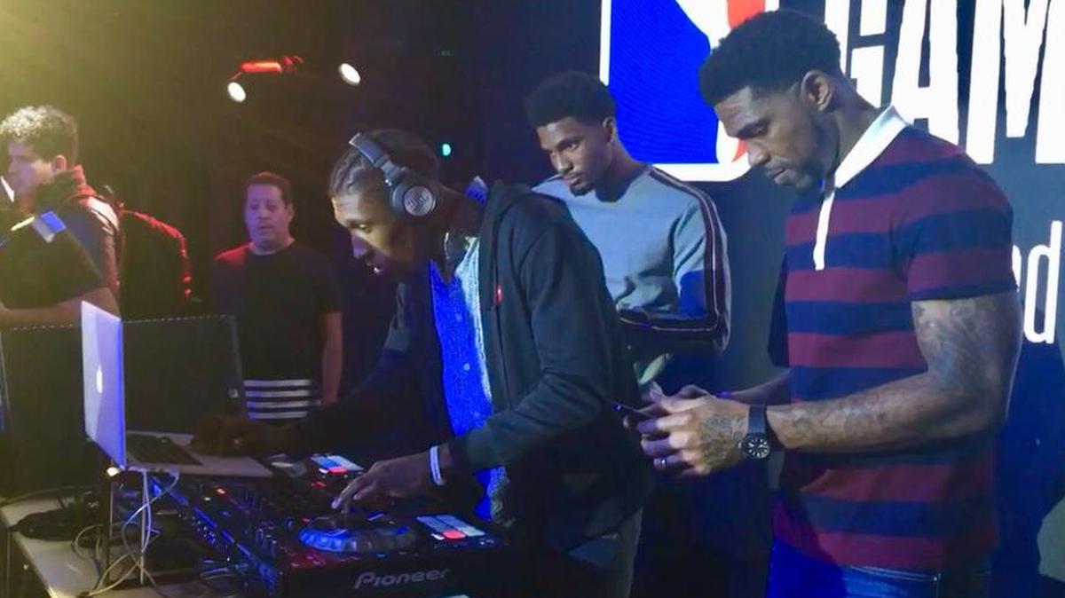 The Heat’s Josh Richardson takes over the DJ responsibilities at an NBA party at a nightclub in Mexico City on Dec. 8, 2017 while teammates Udonis Haslem, right, and Justise Winslow, rear, watch him.