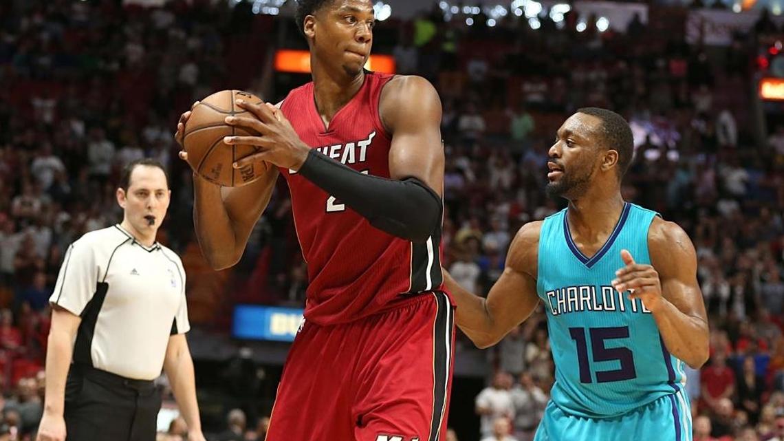 Miami Heat center Hassan Whiteside, holds the ball against Hornets' Kemba Walker, in the fourth quarter of the Miami Heat vs Charlotte Hornets, NBA game at AmericanAirlines Arena in Miami on Wednesday, March 8, 2017.