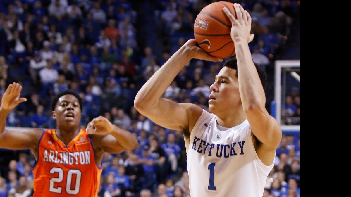 
Kentucky's Devin Booker (1) shoots a three-point shot near Texas-Arlington's Julien Harris (20) during the second half Tuesday, Nov. 25, 2014, in Lexington, Ky. 
