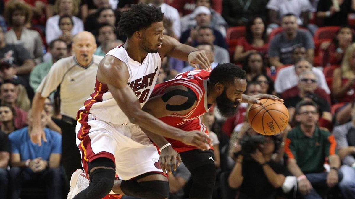 Heat rookie Justise Winslow plays tight defense on Houston Rockets star James Harden during Miami’s victory Nov. 1. Harden finished the night with 16 points on 2-of-15 shooting.