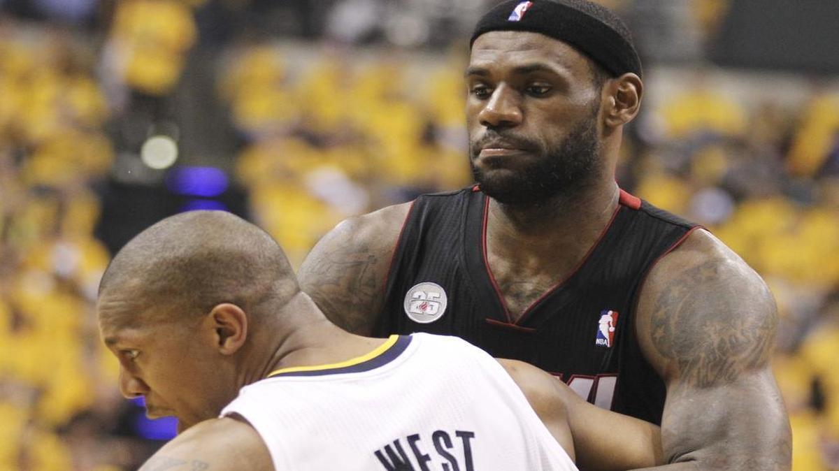 
LeBron James, right, and David West battle on May 28, 2013. James, now with the Cavaliers, appears to be strong-arming owner Dan Gilbert during free agency. Meanwhile, West took a huge pay cut to join the Spurs.
