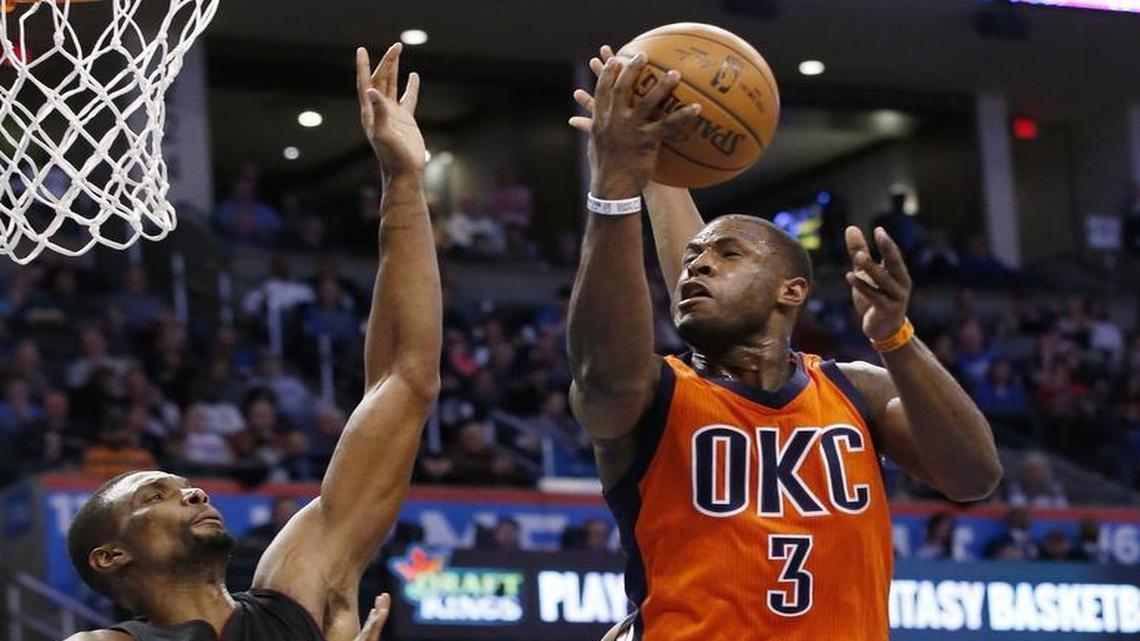 Oklahoma City Thunder guard Dion Waiters (3) shoots in front of Miami Heat forward Chris Bosh in the fourth quarter of an NBA basketball game in Oklahoma City, Sunday, Jan. 17, 2016. Oklahoma City won 99-74.