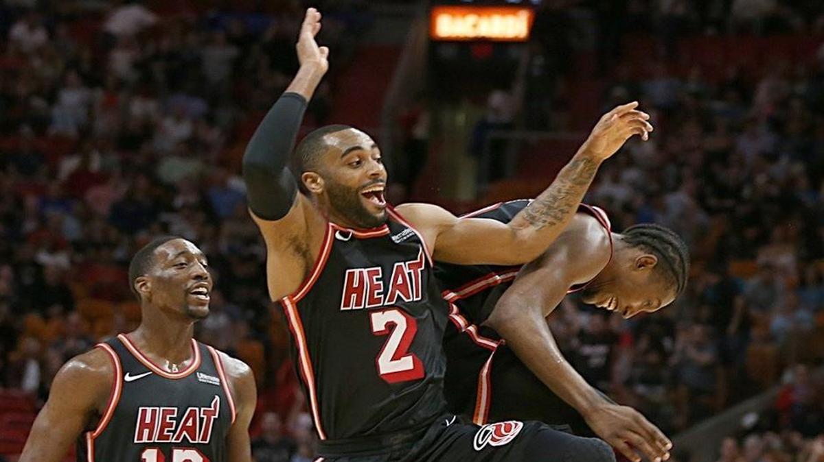 The Heat’s Bam Adebayo and Josh Richardson celebrate a Wayne Ellington 3-pointer as Miami leads the Dallas Mavericks in the fourth quarter at AmericanAirlines Arena in Miami on Dec. 22, 2017.