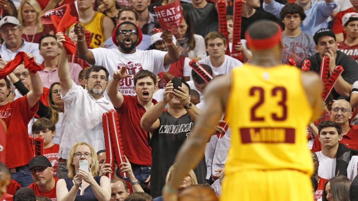Heat fans attempt to distract Cleveland Cavaliers forward LeBron James as the Miami Heat host the Cleveland Cavaliers at the AmericanAirlines Arena in Decemeber 2014.