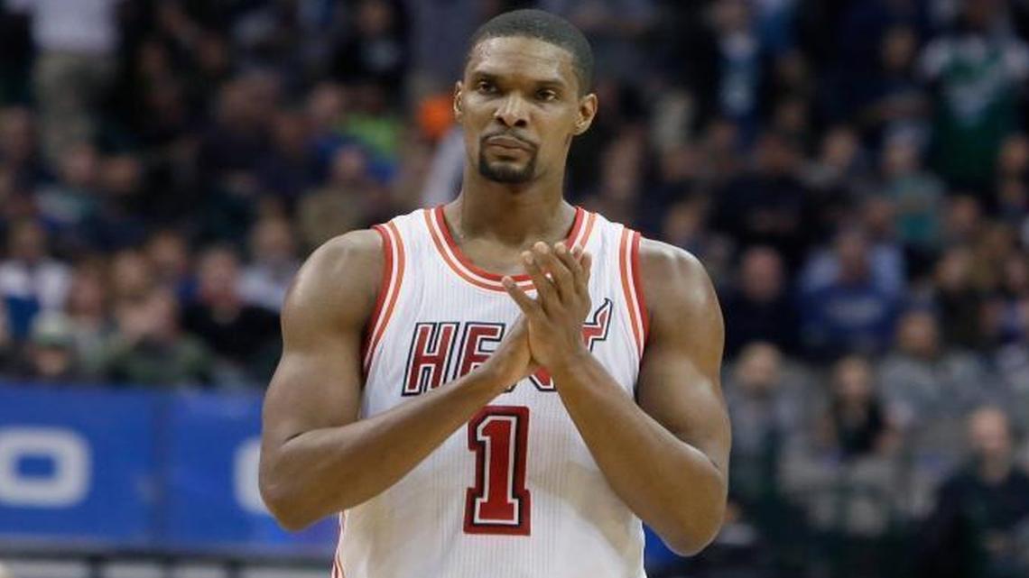 Miami Heat forward Chris Bosh (1) reacts to a call during the second half of an NBA basketball game against the Dallas Mavericks Wednesday, Feb. 3, 2016, in Dallas.