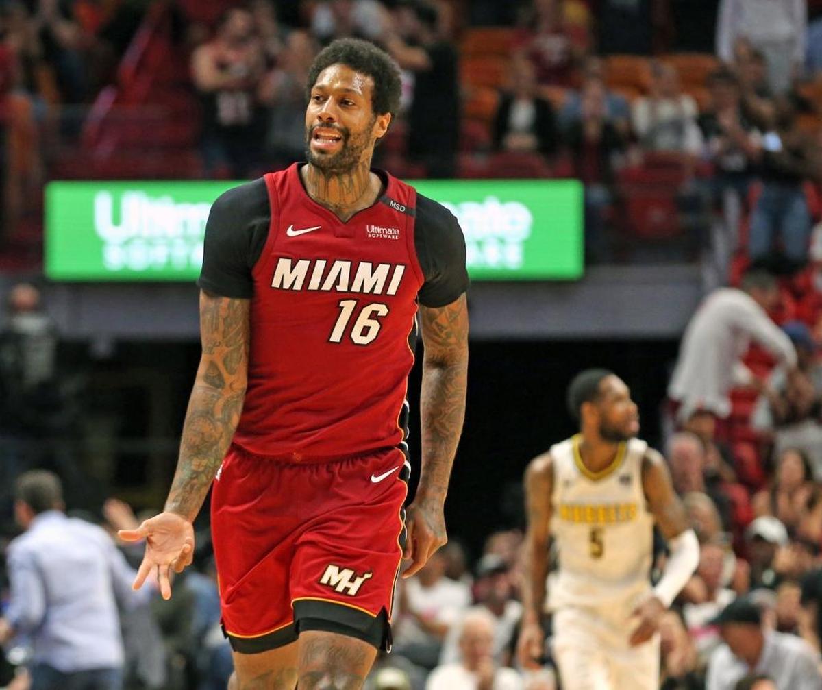 Miami Heat forward James Johnson singles a three-pointer at the end of regulation as they play the Denver Nuggets at the AmericanAirlines Arena in Miami, Florida, March 19, 2018.
