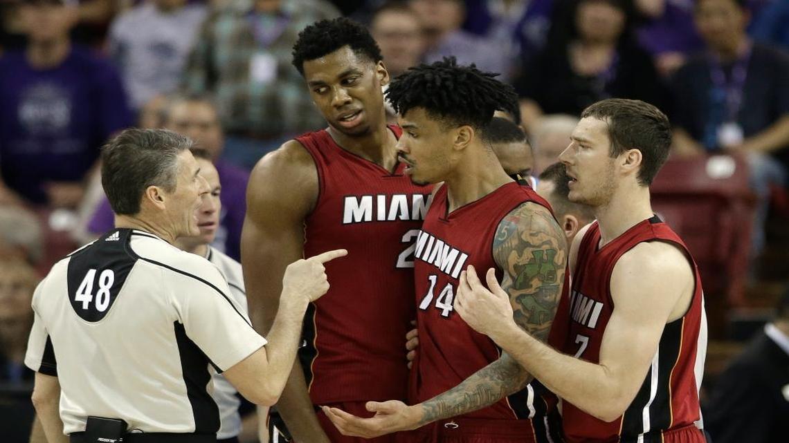 Miami Heat forward Gerald Green, second from right, questions official Scott Foster, who called him for a technical foul, as the Heat's Hassan Whiteside, third from right, and Goran Dragic, right, of Slovenia, look on during the second half of an NBA basketball game against the Sacramento Kings Friday, April 1, 2016, in Sacramento, Calif. The Heat won 112-106.