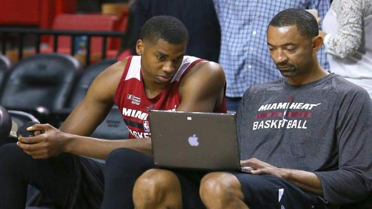 
Miami Heat center Hassan Whiteside works with assistant coach Juwan Howard before the game against the Toronto Raptors at AmericanAirlines Arena in Miami on Saturday, April 11, 2015.
