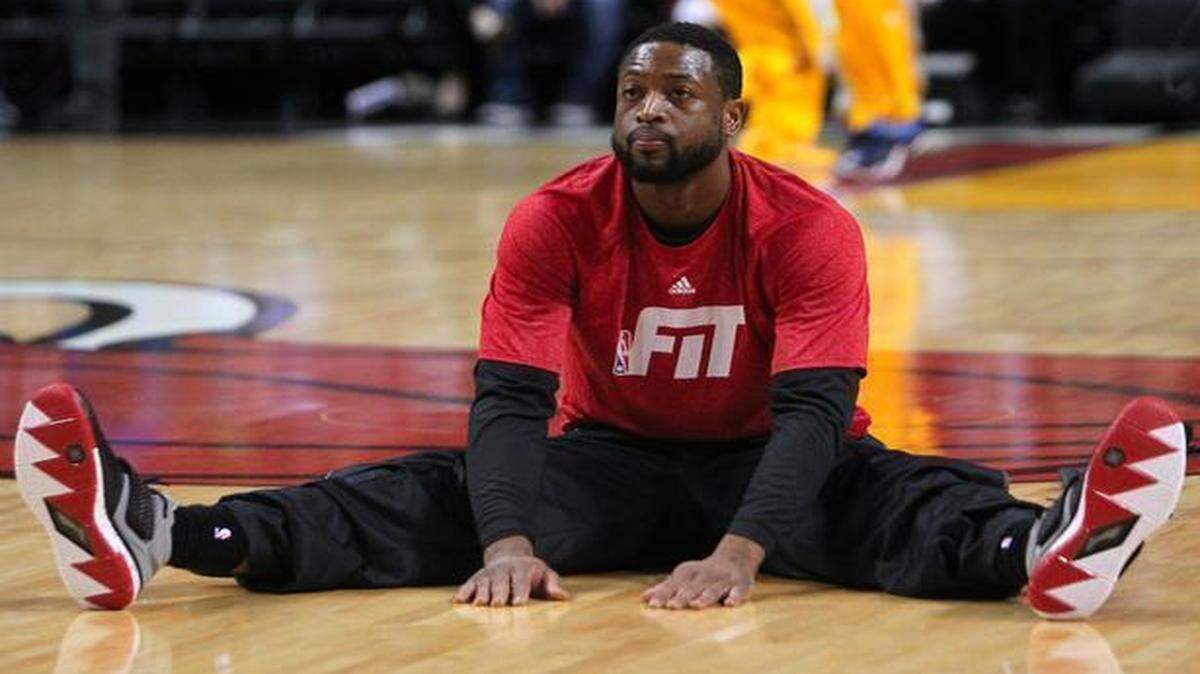 
Miami Heat guard Dwyane Wade stretches before a game against the Indiana Pacers at AmericanAirlines Arena in Miami on Friday, Jan. 23, 2014.
