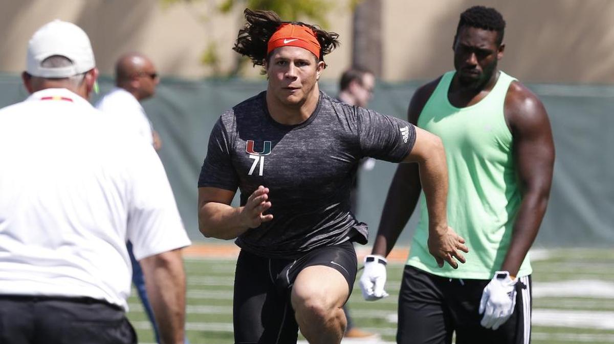 
Anthony Chickillo runs through drills as the University of Miami Hurricanes hold Pro Day, their local combine for the NFL Draft at Greentree Field on the Coral Gables campus. NFL coaches, assistants and general managers watch several Hurricanes do combine-like activities: run, jump, lift, agility drills, etc. on April 1, 2015.
