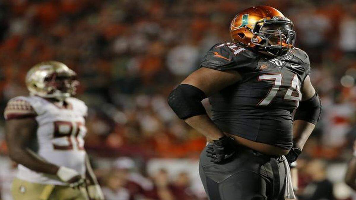 
Miami Hurricanes offensive lineman Ereck Flowers (#74) reacts after a play during the fourth quarter against the Florida State Seminoles at Sun Life Stadium in Miami Gardens on Saturday, November 15, 2014.
