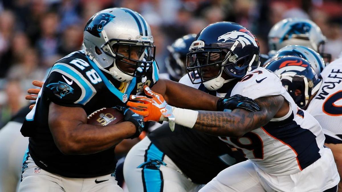 Carolina Panthers Jonathan Stewart, left, runs around Denver Broncos Danny Trevathan during the first half of the NFL Super Bowl 50 football game Sunday, Feb. 7, 2016, in Santa Clara, Calif.