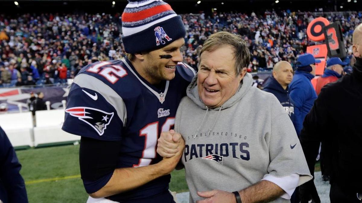 New England Patriots quarterback Tom Brady celebrates with coach Bill Belichick after beating the Dolphins 41-13 in 2014.