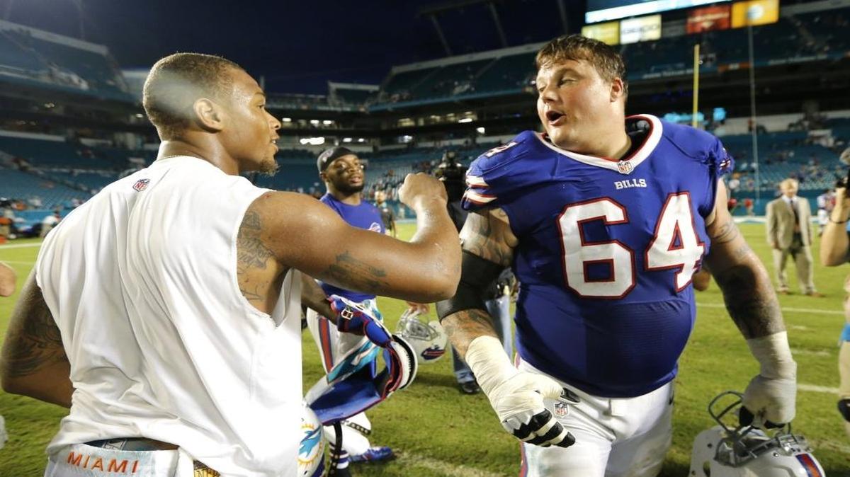 
Miami Dolphins wide receiver Rishard Matthews (18) greets Buffalo Bills offensive guard Richie Incognito (64) after the game.The Miami Dolphins host the Buffalo Bills in the home opener at Sun Life Stadium in Miami Gardens on Sunday, September 27, 2015.
