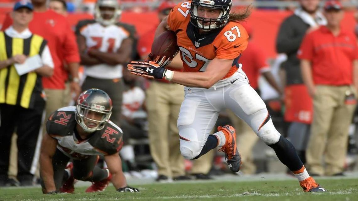 Brent Grimes, left, owes nearly $200,000 to the federal government.