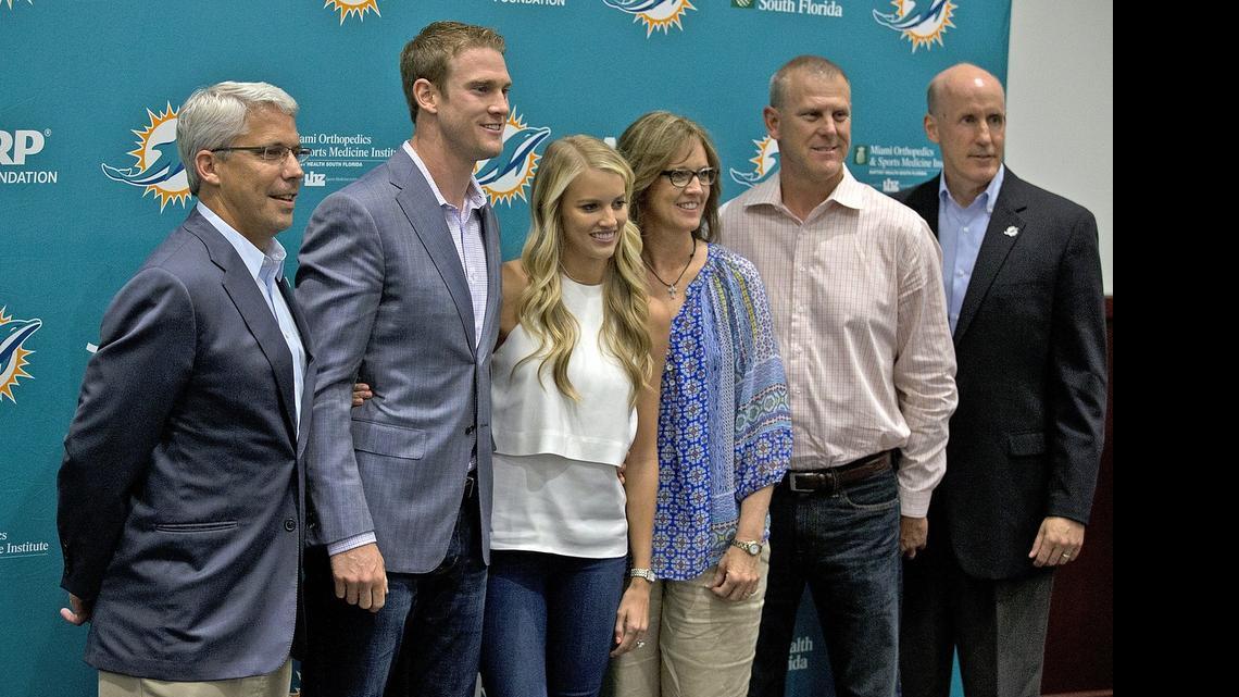 
Miami Dolphins quarterback Ryan Tannehill, second from left, poses with GM Dennis Hickey, left, Tannehill’s wife Lauren, his parents Cheryl and Tim and coach Joe Philbin during a news conference to announce his new $96 million contract Tuesday, May 19, 2015.

