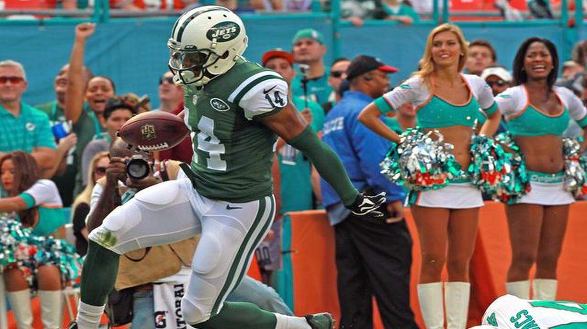 
Miami Dolphins defender Jordan Kovacs misses New York Jets wide receiver Chris Owusu as he crosses into the end zone at Sun Life Stadium in Miami Gardens on Sunday, Dec. 28, 2014.
