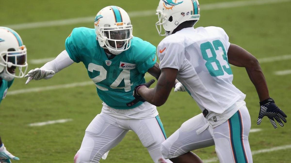 
Brice McCain, left, covers Matt Hazel during end zone drills on Day 4 of Miami Dolphins training camp Sunday, Aug. 2, 2015 at the team’s training facility in Davie.
