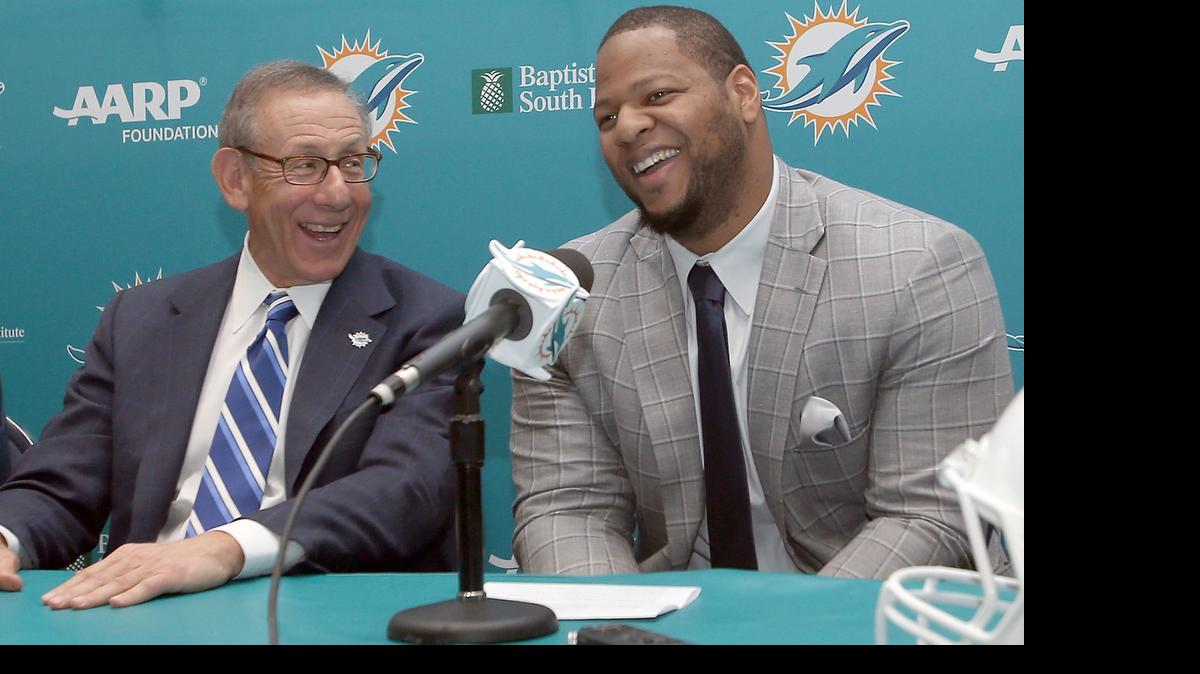 
Miami Dolphins owner Stephen Ross is pictured with Ndamukong Suh during Suh’s introductory press conference Wednesday, March 11, 2015.
