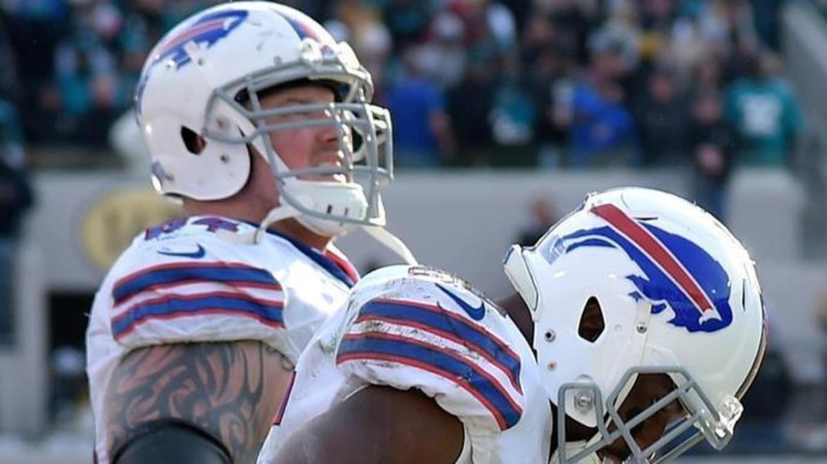 Buffalo Bills running back LeSean McCoy (25) and offensive guard Richie Incognito (64) react on the sideline during the final seconds of the second half of an NFL wild-card playoff football game against the Jacksonville Jaguars on Sunday, Jan. 7, 2018.