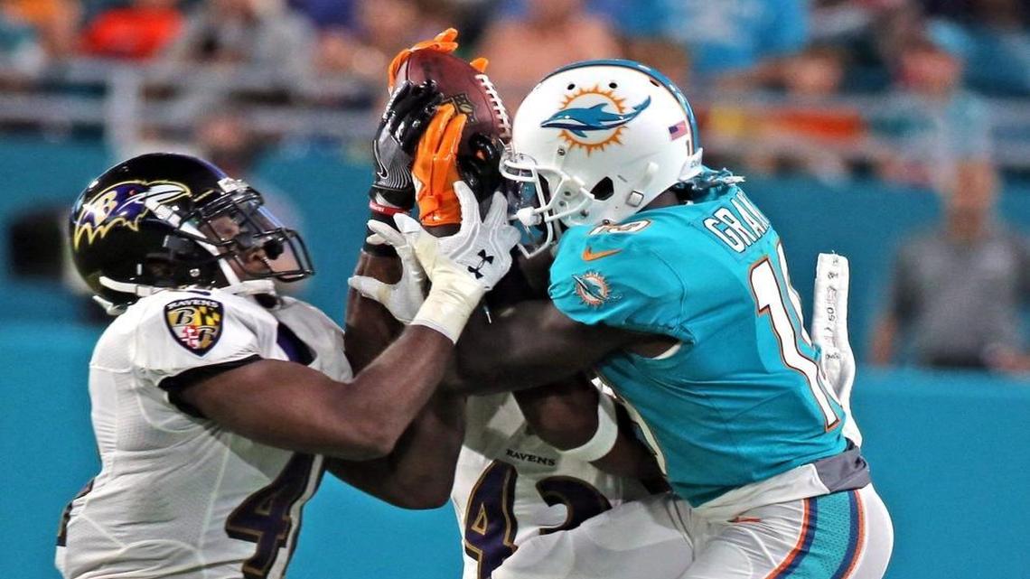 Dolphins Jakeem Grant (19) fights Ravens Anthony Levins (41) for the ball in the second quater as the Miami Dolphins play the Baltimore Ravens in their second preseaon game at Hard Rock Stadium in Miami Gardens, FL, Aug.17, 2017. The ball was ruled dead.