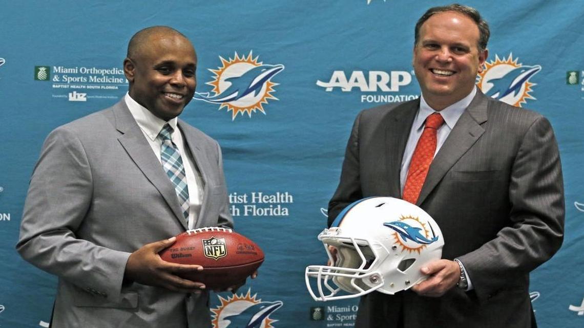New Miami Dolphins general manager Chris Grier poses with executive vice president of football operations Mike Tannenbaum on January 4, 2016 in Davie, Florida.