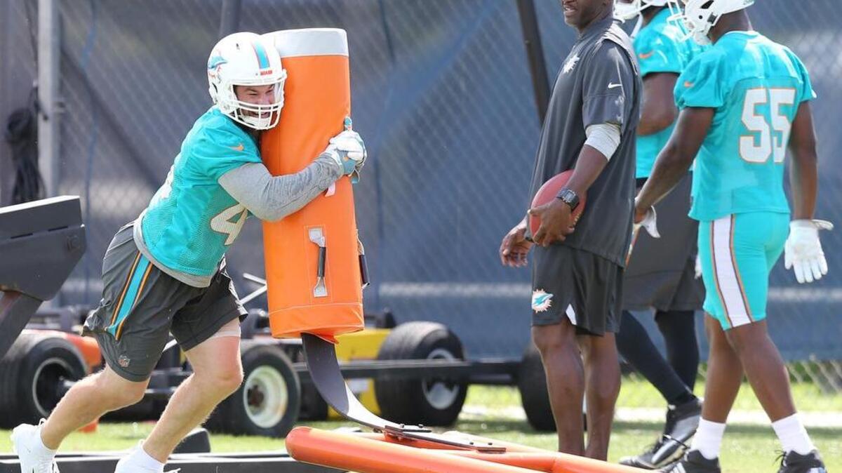 Linebacker Mike Hull (45) hits a sled at OTAs at the Miami Dolphins training facility in Davie, Florida, June 12, 2018.