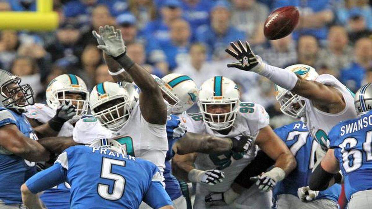 
Miami Dolphins lineman Earl Mitchell blocks a field goal attempt by Detroit Lions kicker Matt Prater in the third quarter of their game at Ford Field in Detroit on Nov. 9, 2014.
