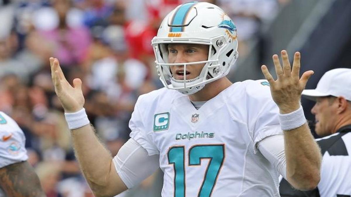 Ryan Tannehill, gesturing toward the bench during Sunday’s loss in New England, said of the team’s offense, ‘We need to move the ball early, get points on the board and give our defense a break. We’re working to get it fixed.’
