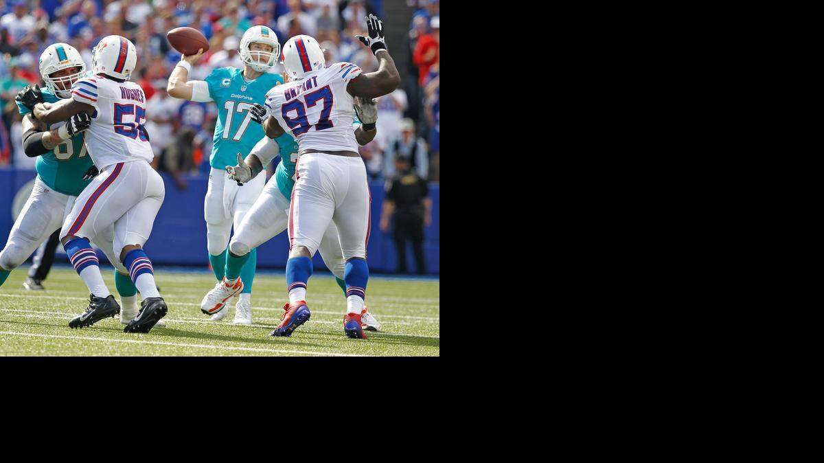 
Miami Dolphins quarterback Ryan Tannehill (17) sets up to pass in the fourth quarter as the Buffalo Bills host the Miami Dolphins at Ralph Wilson Stadium on Sunday, Sept. 14, 2014.
