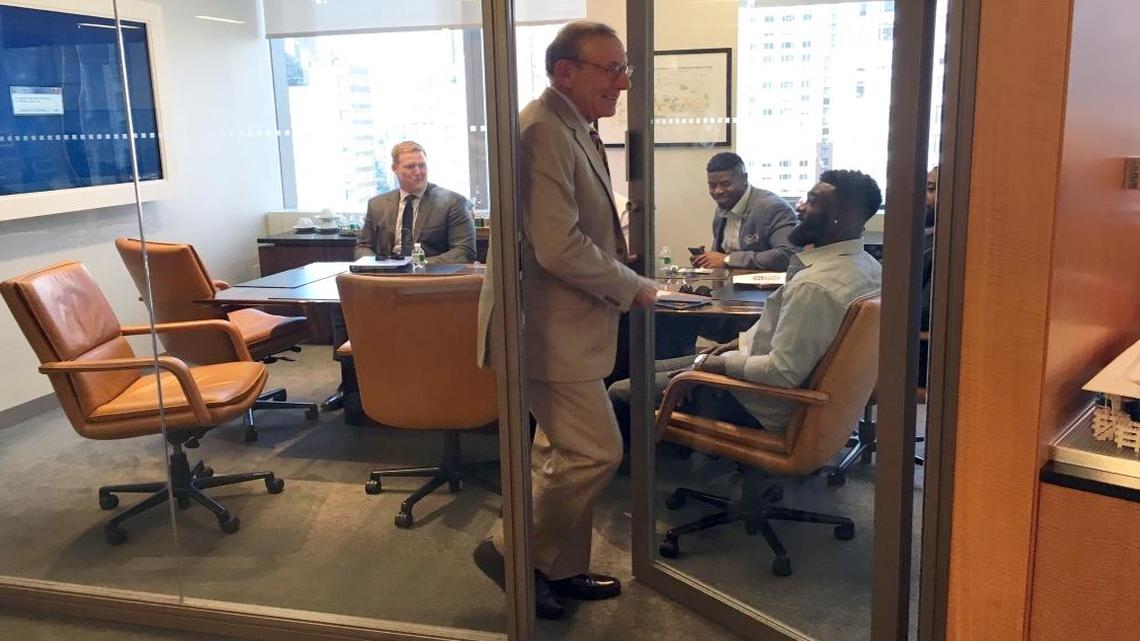 Dolphins owner Stephen Ross exits a conference room during an internship experience he offered to players Reshad Jones, Cameron Wake, Earl Mitchell, James-Michael Johnson and Sam Young, who learned about Ross’ Related business and other companies while in New York.