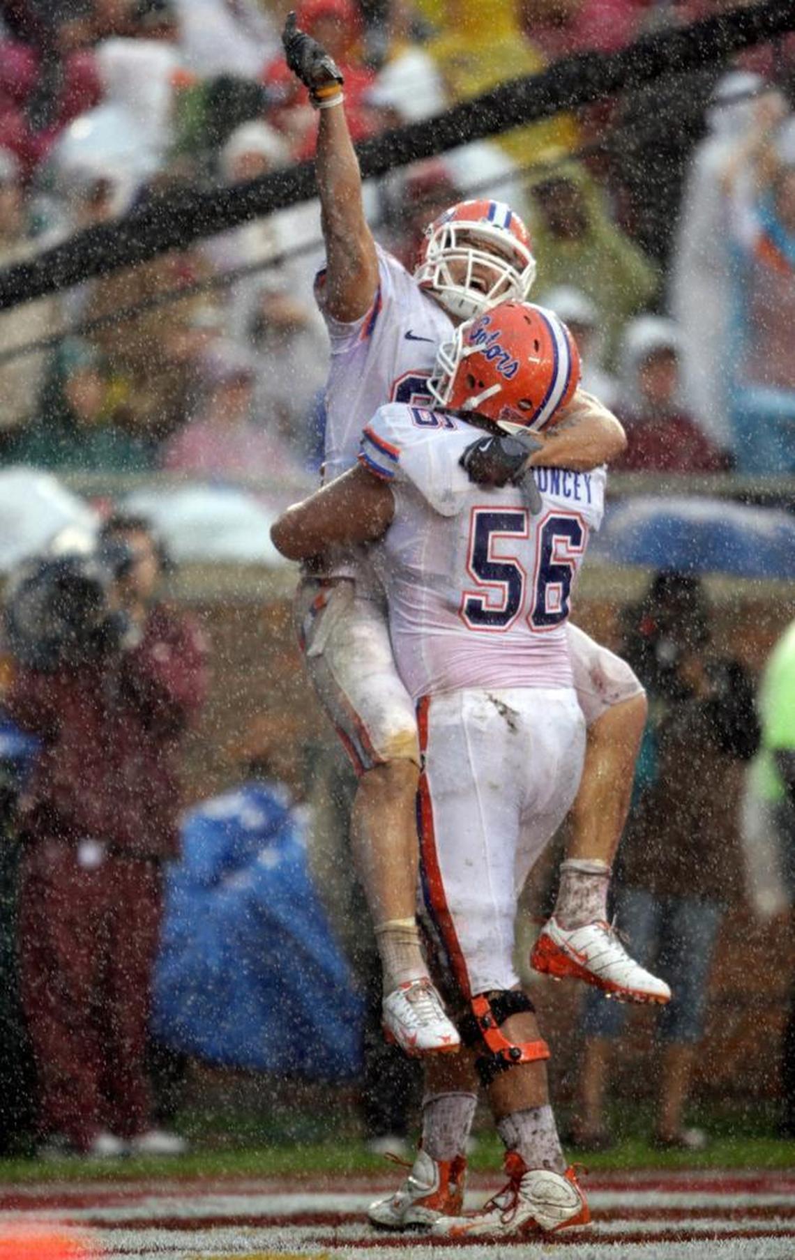 Former University of Florida Gators Aaron Hernandez and Mike Pouncey celebrate a first quarter touchdown reception in 2008.