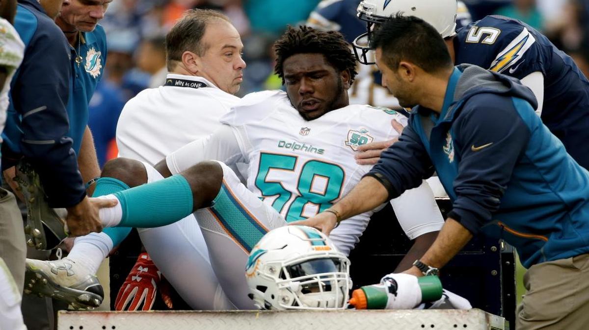 Miami Dolphins linebacker Chris McCain is taken off the field after being hurt during the second half in an NFL football game against the San Diego Chargers Sunday, Dec. 20, 2015, in San Diego.