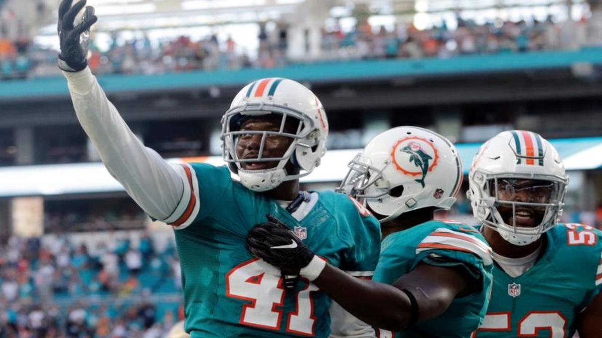 Byron Maxwell, left, and Jelani Jenkins, right, will not be making any plays for the Dolphins Saturday.