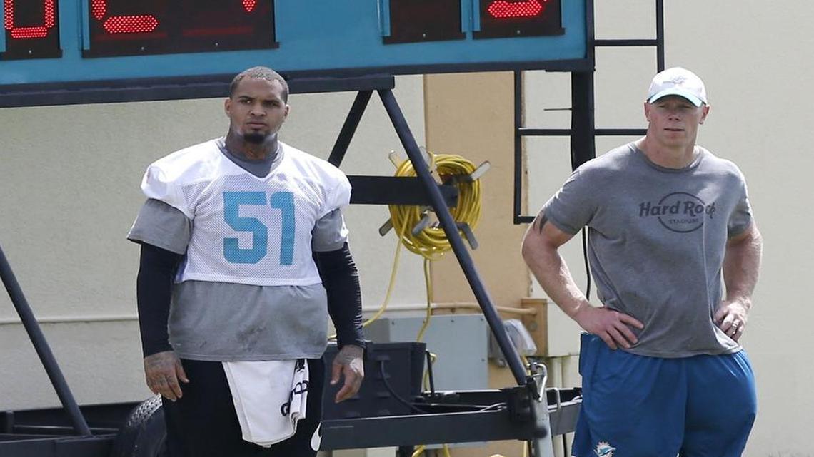Mike Pouncey could only watch Dolphins minicamp practice Thursday.