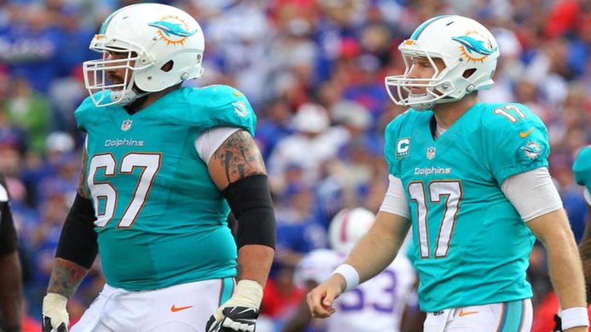 
Miami Dolphins left guard Daryn Colledge, shown with Ryan Tannehill earlier this season at Buffalo, asked coaches to remove him from Sunday’s game against Jacksonville after giving up two sacks while dealing with a migraine. 
