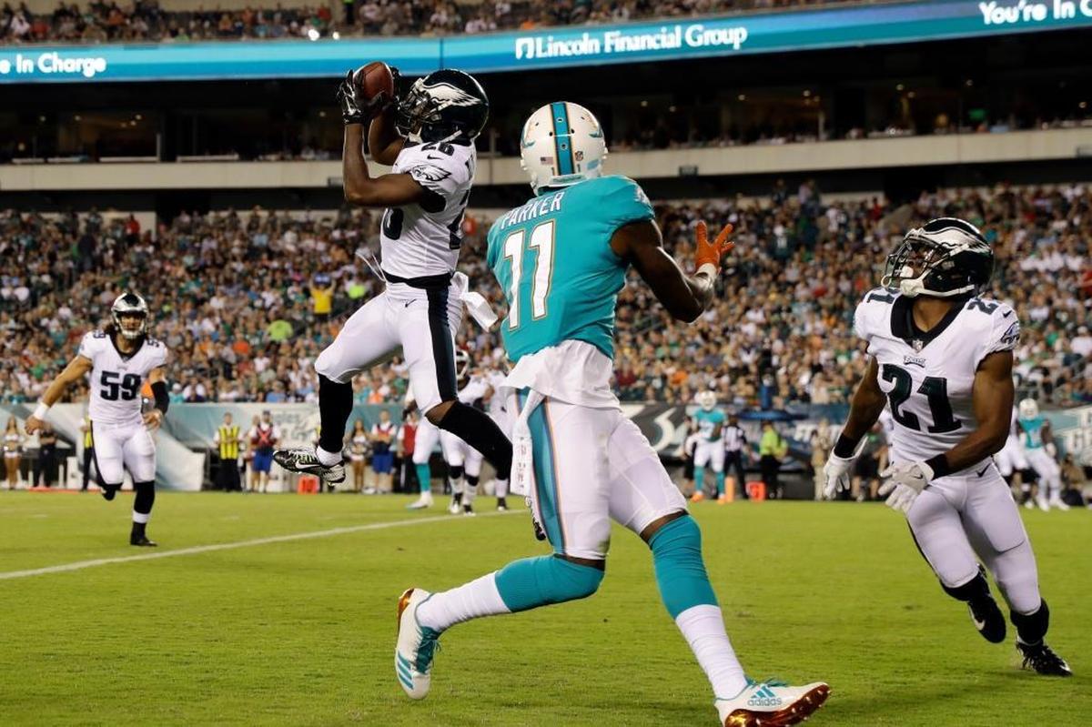 Philadelphia Eagles' Jaylen Watkins (26) pulls in an interception against Miami Dolphins' DeVante Parker (11) during the first half of a preseason NFL football game, Thurs., Aug. 24, 2017, in Philadelphia.