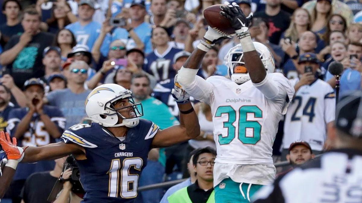 Dolphins cornerback Tony Lippett intercepts a pass intended for Chargers wide receiver Tyrell Williams late in the fourth quarter to seal Miami’s victory against San Diego on Sunday. Lippett had two interceptions in the game.