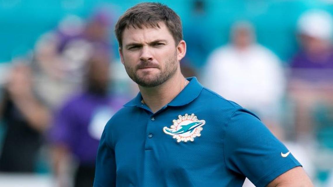 Interim offensive coordinator Zac Taylor looks on during warmups before the Miami Dolphins host the Baltimore Ravens at Sun Life Stadium on Sunday, December 6, 2015.