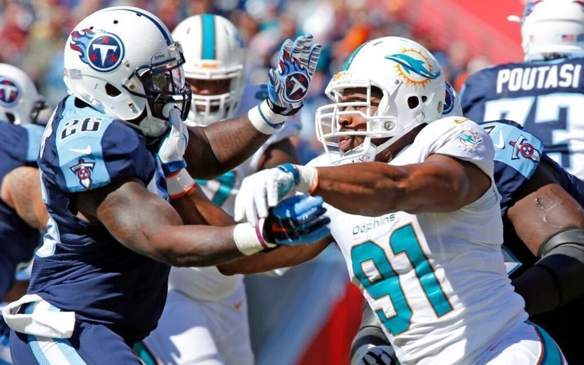 Miami Dolphins defensive end Cameron Wake, who finished with four sacks, rushes against Tennessee Titans running back Antonio Andrews in the second quarter at Nissan Stadium in Nashville, Tenn., on Sunday, October 18, 2015.
