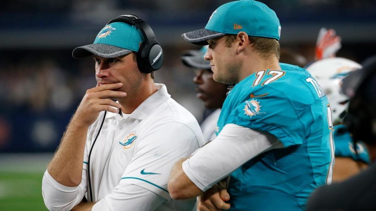 Miami Dolphins head coach Adam Gase, left, stands on the sideline with quarterback Ryan Tannehill in the second half of an NFL preseason football game against the Dallas Cowboys on Fri., Aug. 19, 2016, in Arlington, Texas.