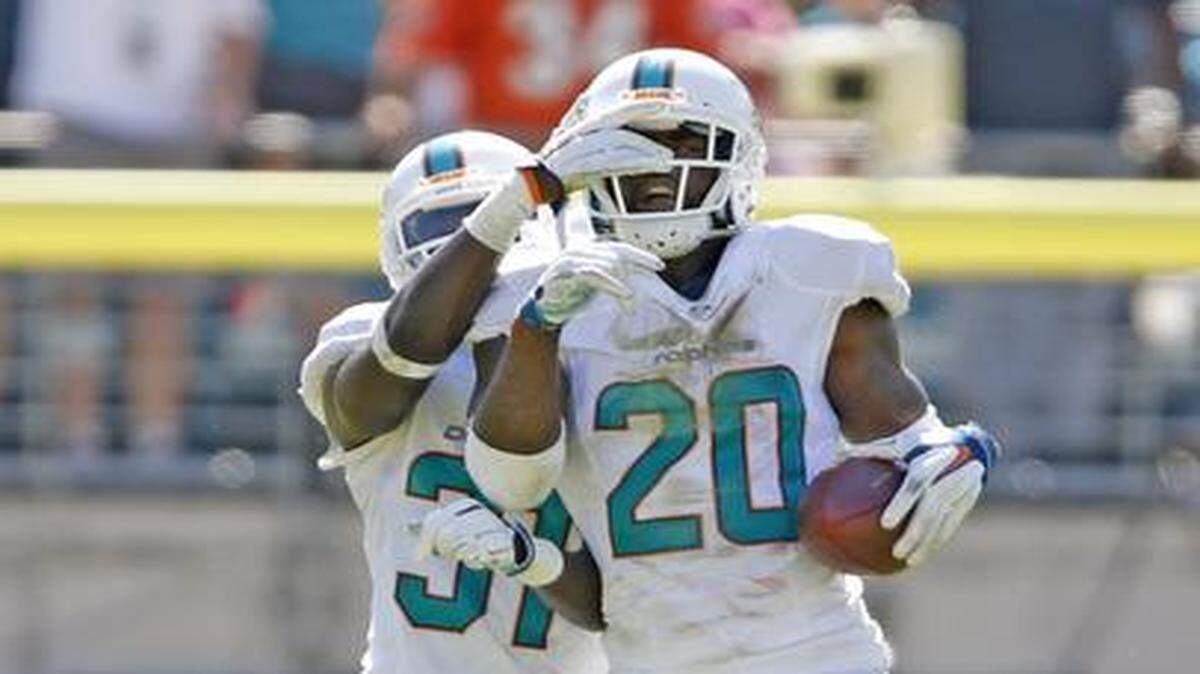 
Dolphins safety Reshad Jones (20) celebrates after recovering a fumble during last Sunday’s victory over the Jaguars.

