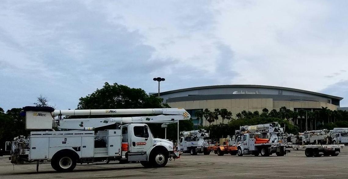 Power trucks use BB&T Center in Sunrise as a staging area before heading north after Hurricane Matthew last October.