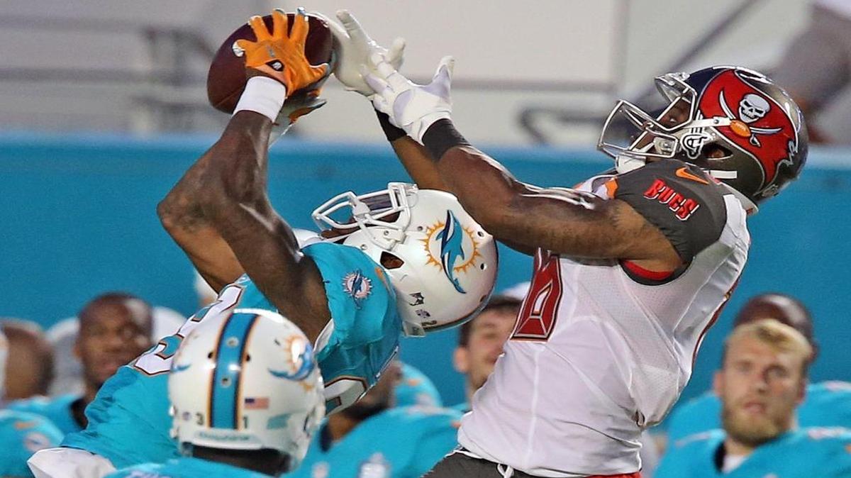 
Miami Dolphins’ Will Davis intercepts the ball in the first quarter at Sun Life Stadium in Miami Gardens, September 3, 2015.
